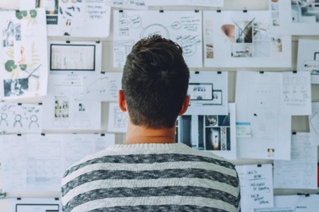 Man looking at Gantt chart timeline