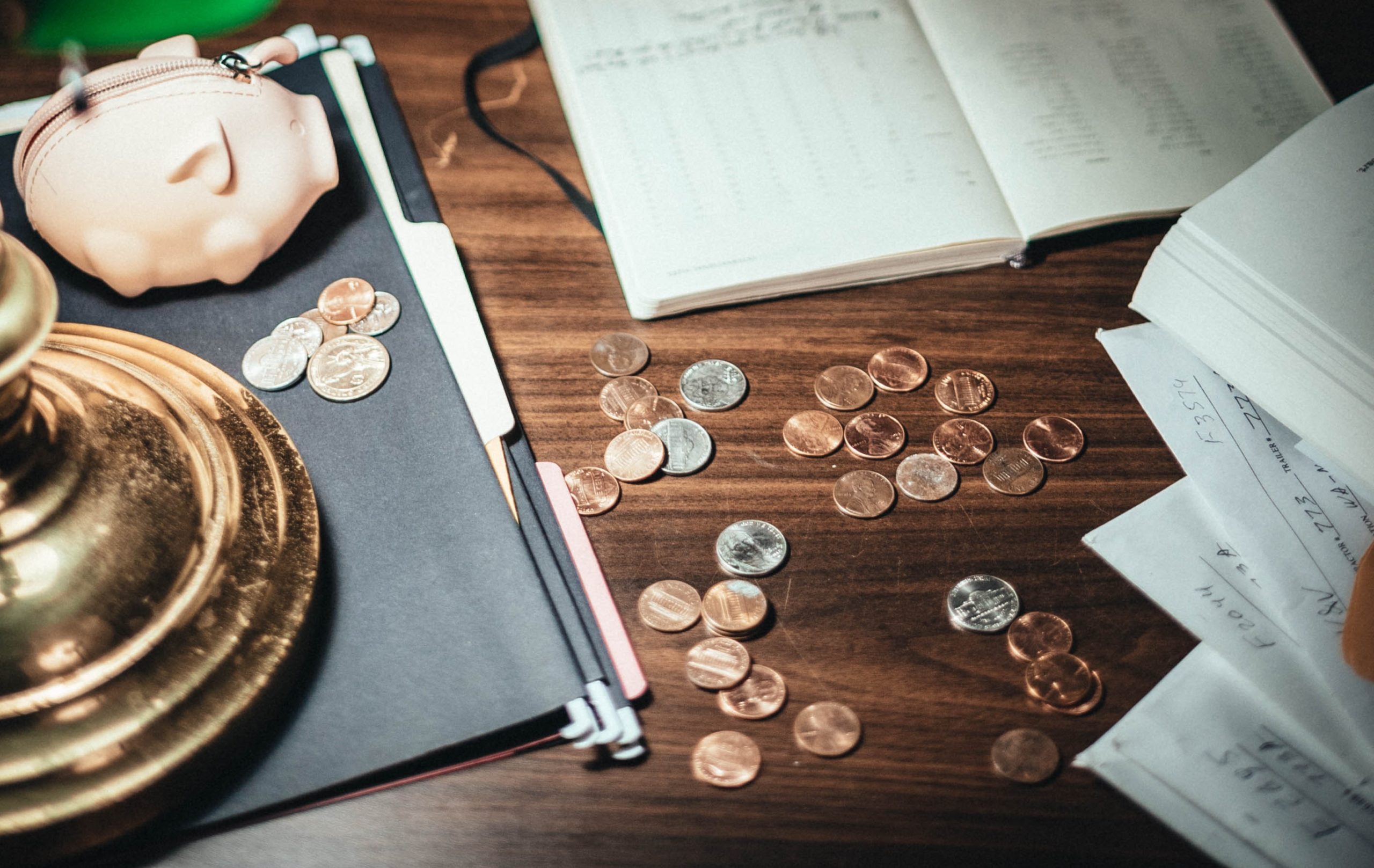 coins and notebooks on a desk