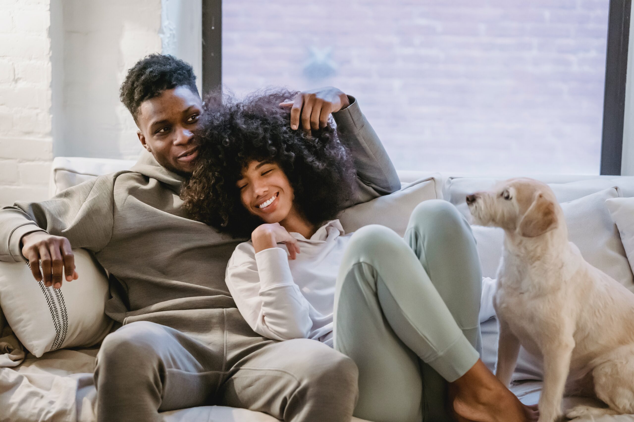 Couple hugging on a couch