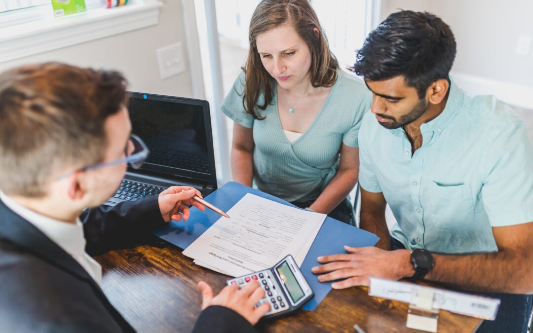 Financial advisor explaining how to pay off your mortgage faster to their clients